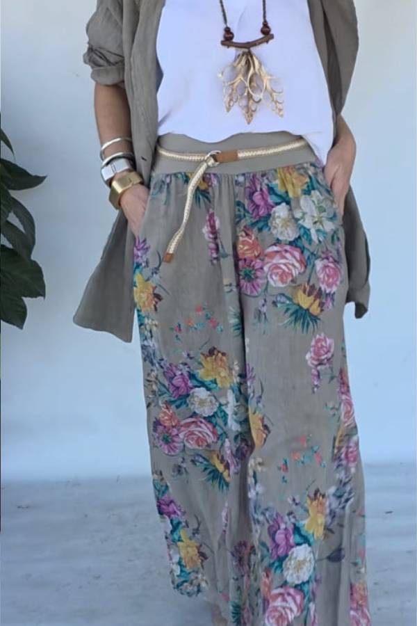 Set of green jacket and wide trousers with floral print