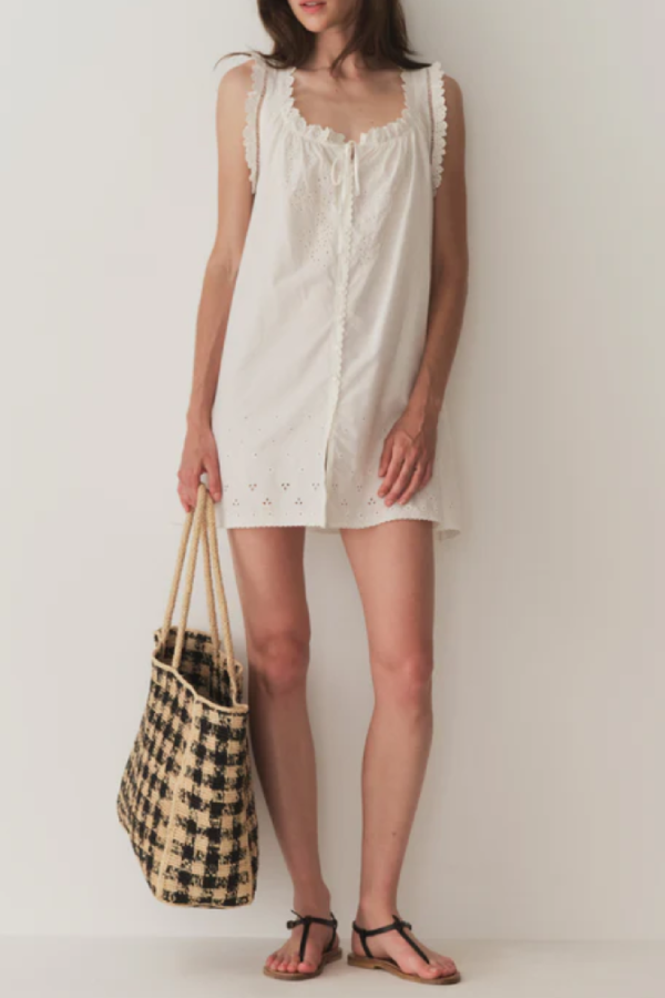 Short Skirt with Pearl Buttons and Scalloped Trim and Round Neck.
